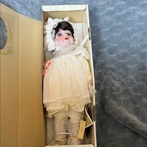 Porcelain Doll with White Dress and Bonnet